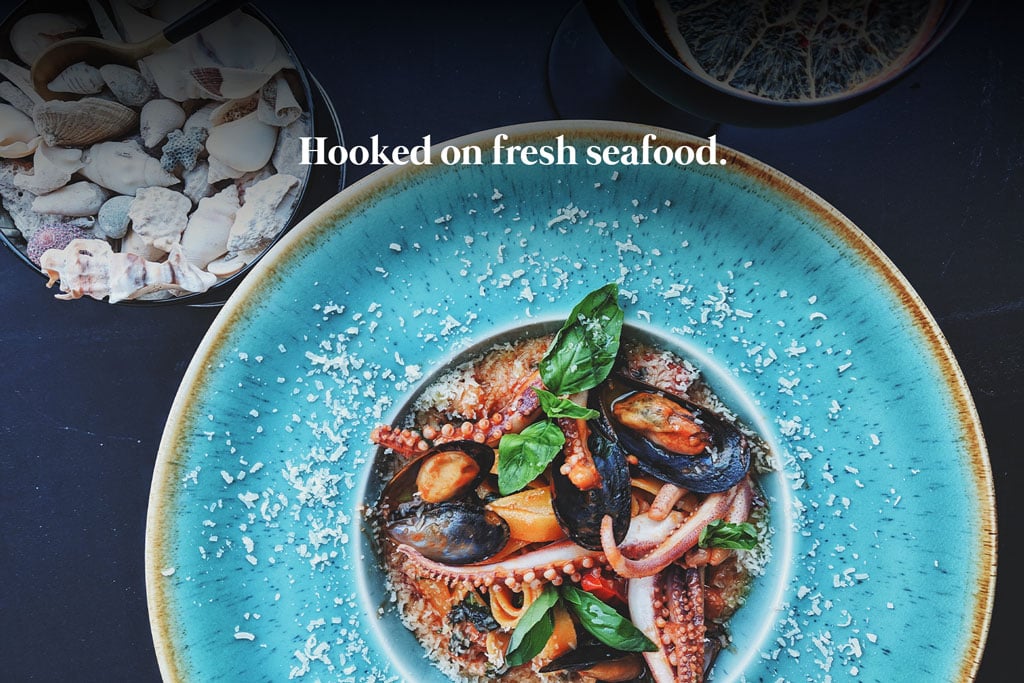 Hooked on fresh seafood. Restaurant slogan.