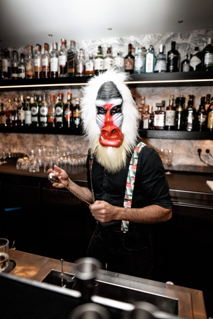 Bartender in monkey mask