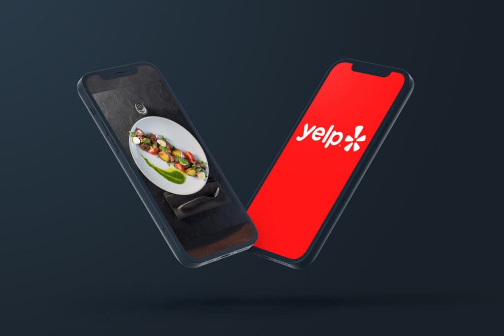 two iphones - one with Yelp logo the other with fine dining photo