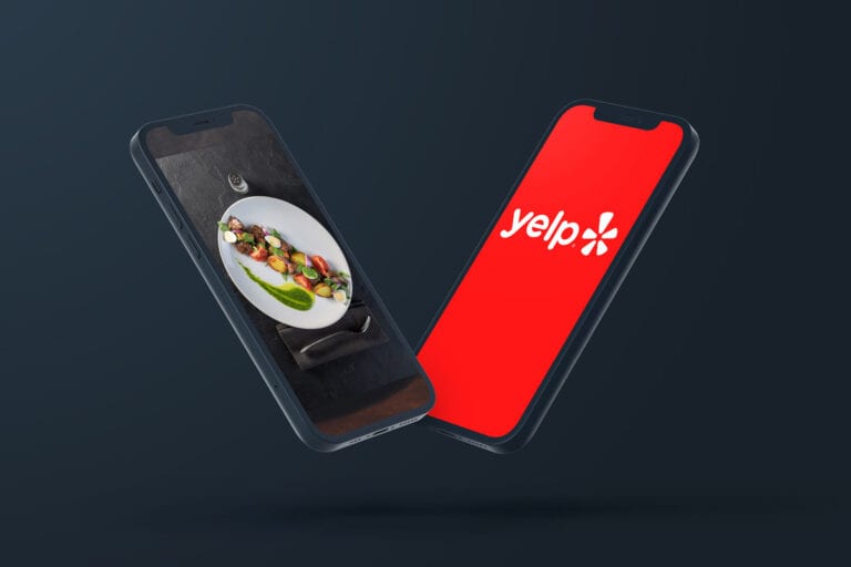 two iphones - one with Yelp logo the other with fine dining photo