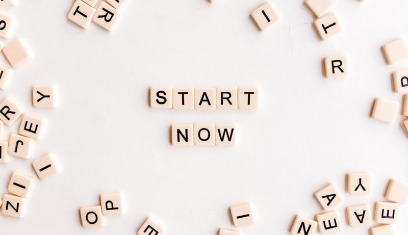 Start now - letters on table
